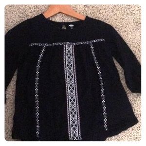Black shirt with cute designs.